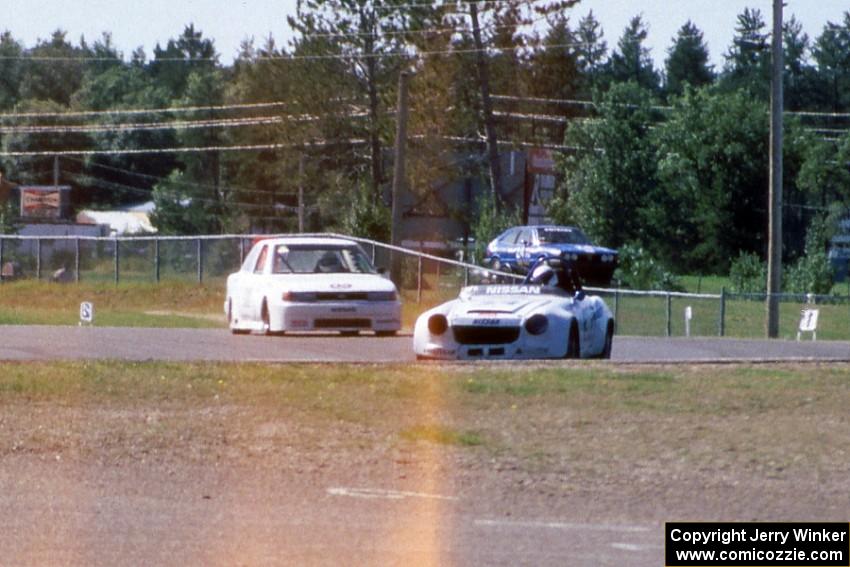 Lee Feineigle's E Production Datsun 2000 and ???'s GT4 Nissan Sentra