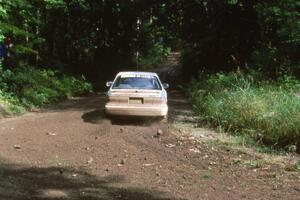 Tim O'Neil / Tom Burgess take a conservative approach out of the corner in their Mitsubishi Galant.