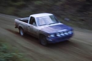 Mark Alderson / Bill Boggs prepare for a left-hander in their Toyota Pickup. Note the sandy braking area.