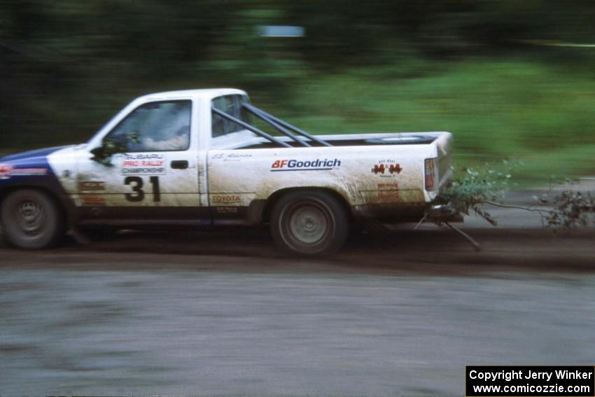 Mark Alderson / Bill Boggs take a small poplar tree along for a ride behind their Toyota Pickup.