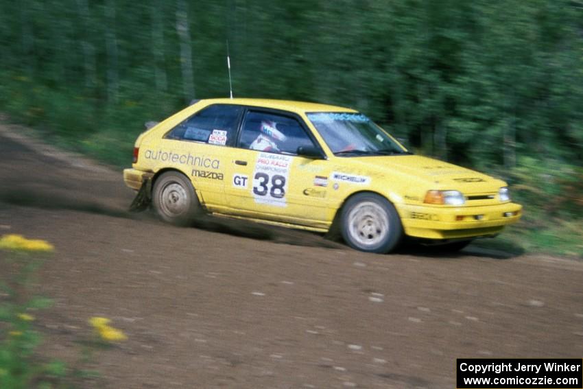 Steve Nowicki / Mark Greenisen blast past in their PGT Mazda 323GTX.