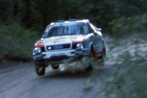 The Paul Choiniere / Jeff Becker Audi Quattro S-2 gets air at the jump at Two Inlets.