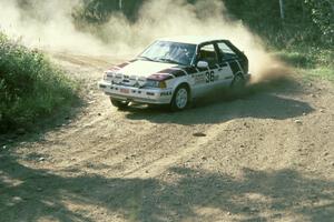 The Craig Sobczak / Kevin DeLoughary Mazda 323GTX at the 90-right on Indian Creek Forest Rd.