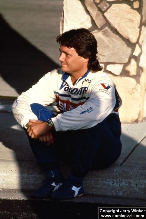 Subaru factory driver Chad DiMarco takes a break on the front step of the Northern Inn.