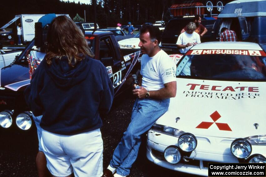 Mexican rally driver Antonio Menendez is interviewed in front of the Mitsubishi Eclipse he shared with Juan Goya.(1)