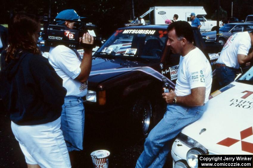 Mexican rally driver Antonio Menendez is interviewed in front of the Mitsubishi Eclipse he shared with Juan Goya.(2)