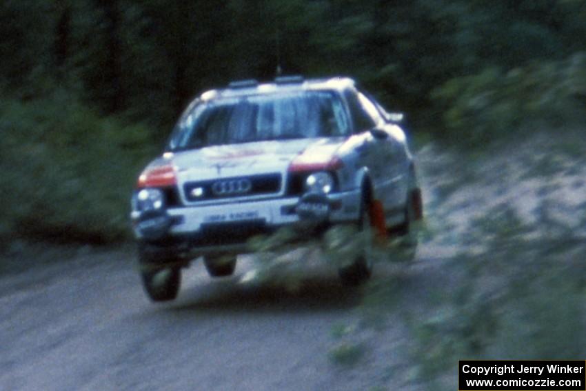 The Paul Choiniere / Jeff Becker Audi Quattro S-2 gets air at the jump at Two Inlets.