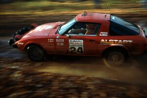 Bruce Newey / Kennon Rymer hit the slippery stuff in their Mazda RX-7.