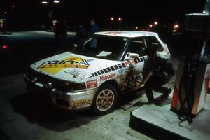 Makio Yamanaka / John McArthur Mazda 323GTX gets gas in L'Anse.