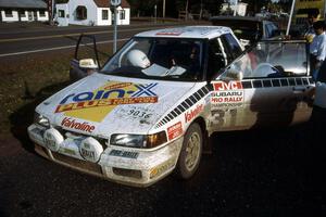 Makio Yamanaka / John McArthur Mazda 323GTX checks into Copper Harbor service (1).