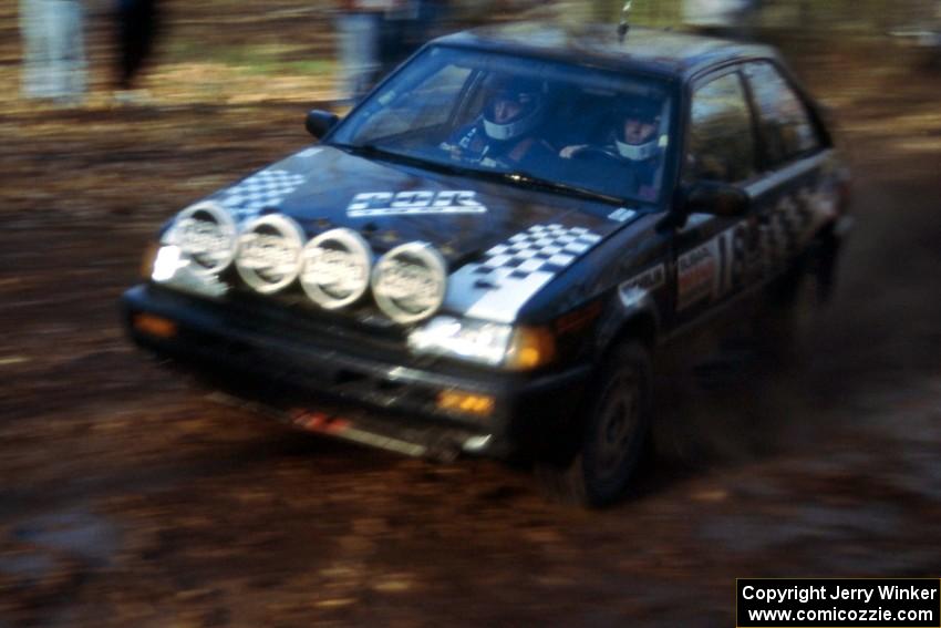 Steve Gingras / Bill Westrick muddy up their Mazda 323GTX.