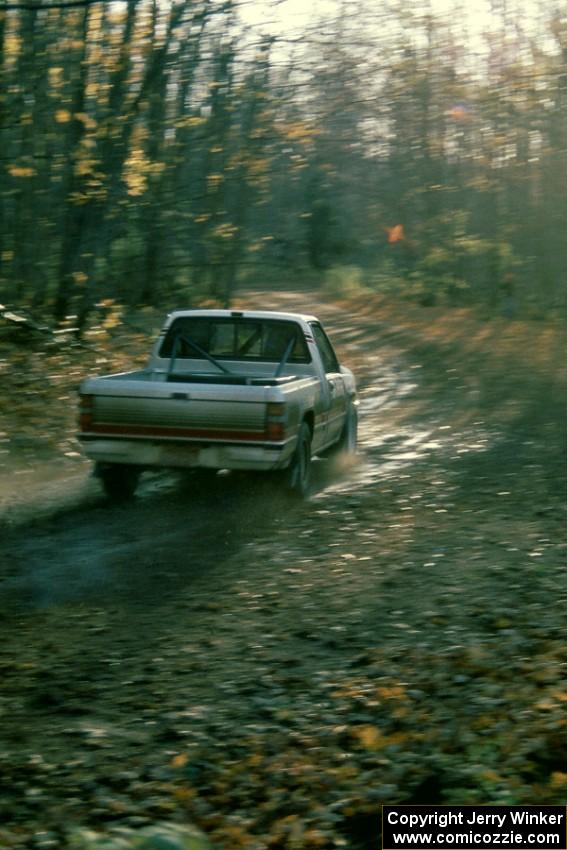 Roger Hull / John Elkin slide through a corner in their Mitsubishi Pickup.