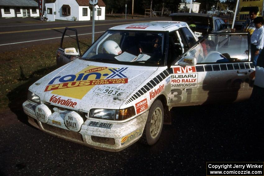 Makio Yamanaka / John McArthur Mazda 323GTX checks into Copper Harbor service (1).