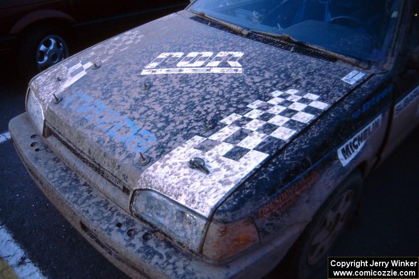 Steve Gingras / Bill Westrick muddy Mazda 323GTX after the finish.