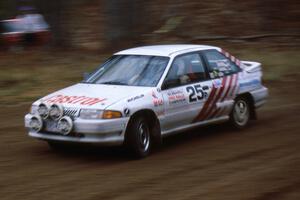 Barry Latreille / Sandy Latreille at speed at the spectator corner on SS1 in their Ford Escort GT.