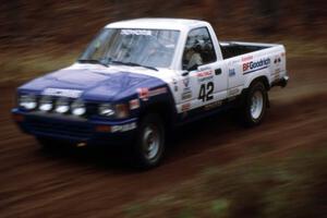 Mark Alderson / Bill Boggs at speed at the spectator location on SS1 in their Toyota Pickup.