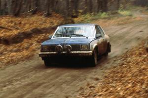 Ed Maklenburg / Barbara Steencken at speed in their Oldsmobile Omega on the first stage of day two.