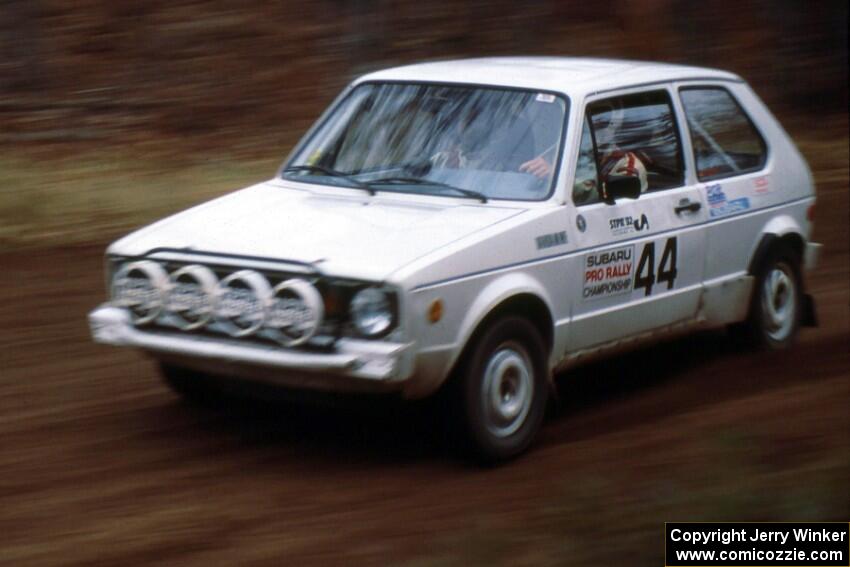 Tom VanDamme / Chuck VanDamme at speed through the SS1 spectator location in their VW Rabbit.