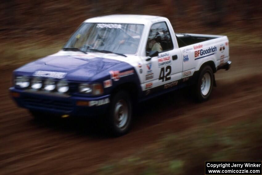 Mark Alderson / Bill Boggs at speed at the spectator location on SS1 in their Toyota Pickup.