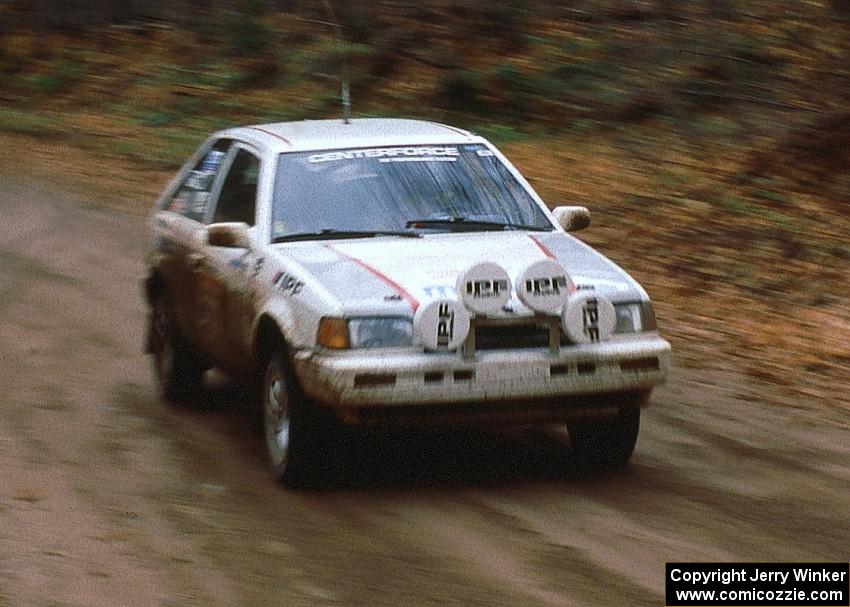 Henry Joy IV / Jimmy Brandt at speed on the first stage of day two in their Mazda 323GTX.