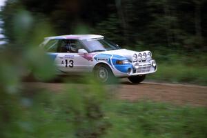 The Peter Moodie / Mike Fennell Mazda 323GTR drifts into the spectator area at the county road.