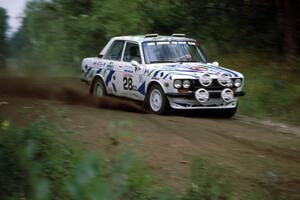 The Mike Whitman / Kevin Linville Datsun 510 drifts into the spectator corner at the county road.