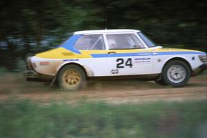 The Goran Ostlund / Steve Baker SAAB 99 blasts down the straight after the spectator corner at the county road.