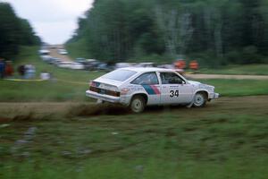 Gail Truess / Cindy Krolikowski fling their Chevy Citation past the crowd at the conty road spectator location.