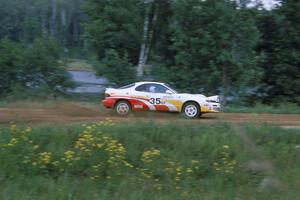 Jason Priestley / Kevin Caffrey accelerate down the county road in their Toyota Celica All-Trac.