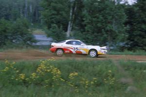 Jason Priestley / Kevin Caffrey accelerate down the county road in their Toyota Celica All-Trac.