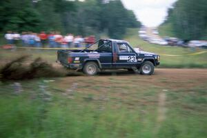 Jeff Hendricks / Noble Jones drift their Jeep Comanche past the spectator location at the county road.