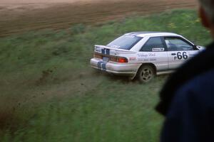 Tad Ohtake / Bob Martin take to the ditch after carrying too much speed in their Ford Escort GT at the county road.