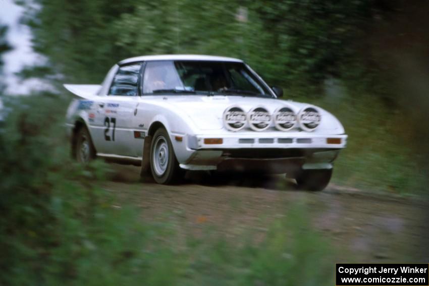 Bryan Pepp / Dean Rushford set their Mazda RX-7 up for the s-curve at the spectator location at the county road.