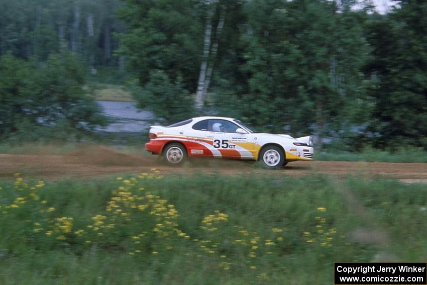 Jason Priestley / Kevin Caffrey accelerate down the county road in their Toyota Celica All-Trac.