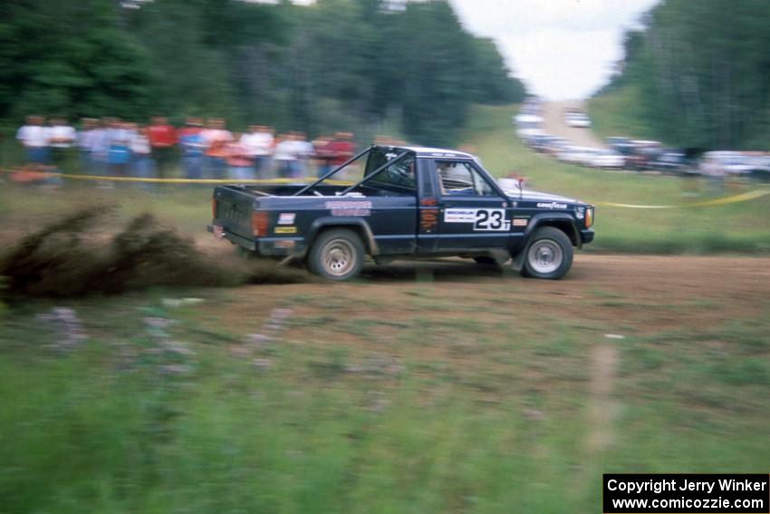 Jeff Hendricks / Noble Jones drift their Jeep Comanche past the spectator location at the county road.