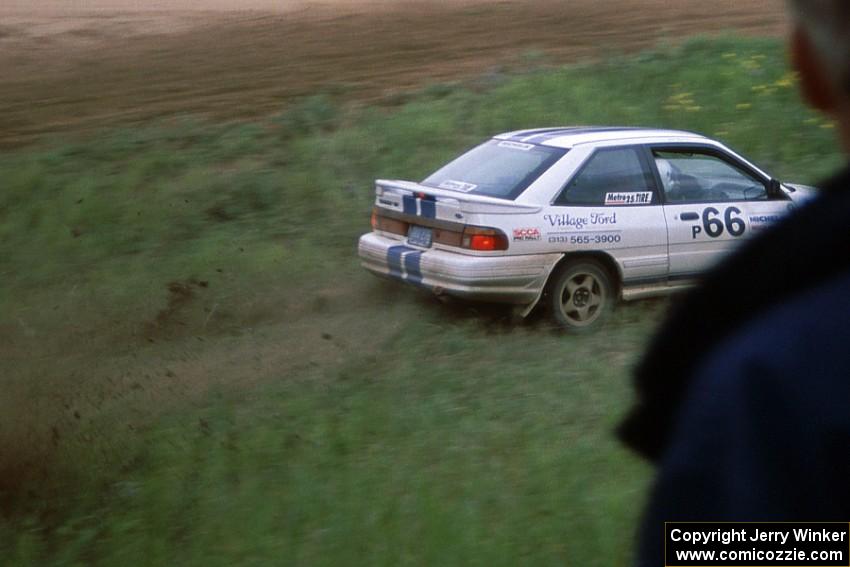 Tad Ohtake / Bob Martin take to the ditch after carrying too much speed in their Ford Escort GT at the county road.