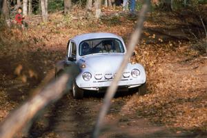 Rene Villemure / Mike Villemure in their VW Beetle kick up leaves near the finish of SS1.