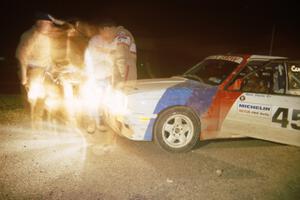 Rick Davis / Ben Greisler BMW M3 at L'Anse service adjusting the lights.