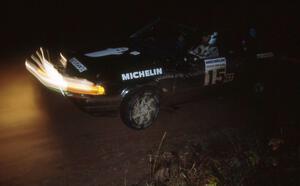 Tom Ottey / Pam McGarvey in their Mazda 323GTX hit the night stages.