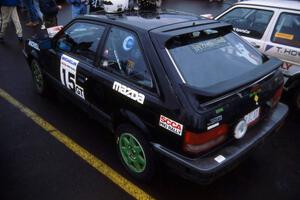 Tom Ottey / Pam McGarvey in their Mazda 323GTX at Saturday morning parc expose in Calumet.