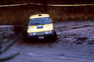 Sam Bryan / Rob Walden in their SAAB 900 kick up gravel at the delta at Delaware.