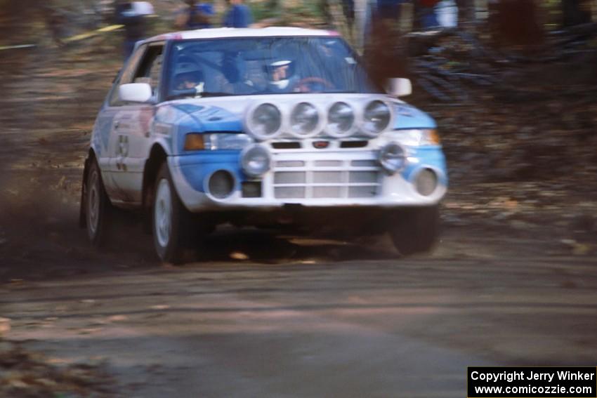 Peter Moodie / Michael Fennell in their Mazda 323GTR blast into the final corners of SS1.