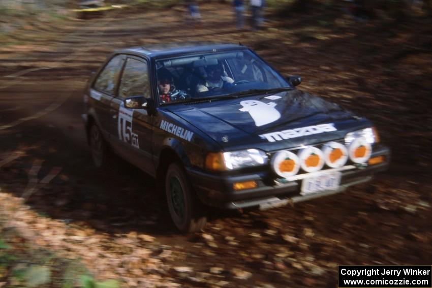 Tom Ottey / Pam McGarvey in their Mazda 323GTX at the finish of SS1.