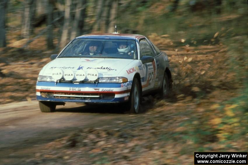 Dave Turner / Bill Gutzman in their Mitsubishi Eclipse kick up leaves near the finish of SS1.