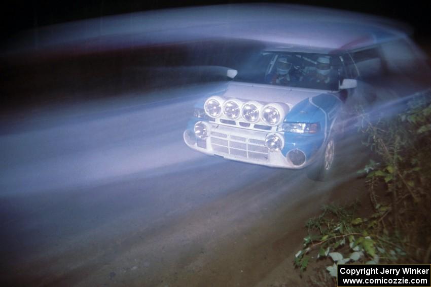 Peter Moodie / Michael Fennell in their Mazda 323GTR are a blur near the finish of the Menge Creek stage.