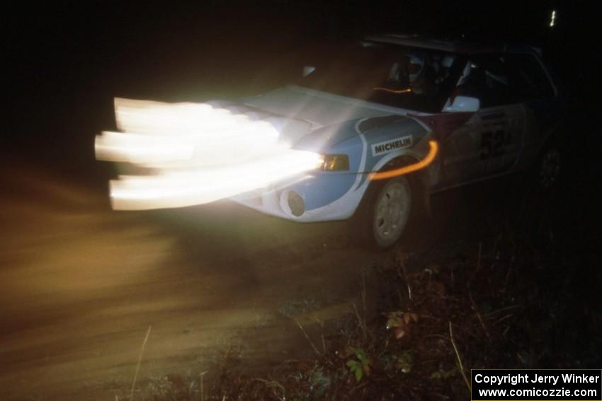 Jamaicans Peter Moodie / Michael Fennell in their Mazda 323GTR blast out of a left-hander.