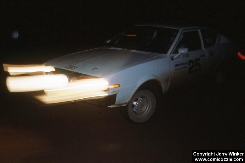 Chris Czyzio / Eric Carlson negotiate the spectator corner on Passmore in their Plymouth Arrow at night.