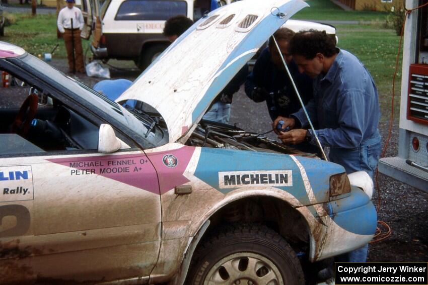 Rod Millen helps the Mazda 323GTR team of Peter Moodie / Michael Fennell.