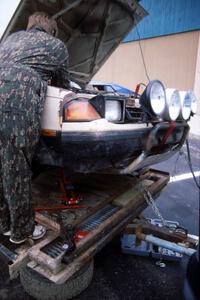 A last minute entry, the Dave Konetski / Glenn Koehler Toyota Celica gets repairs on the trailer prior to parc expose.