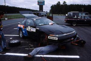 Eric Marcus does some last minute prep-work on the Mitsubishi Eclipse GSX he and Cal Landau shared.